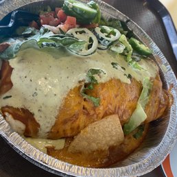 a plate of mexican food and a cup of coffee a plate of mexican food and a cup of coffee