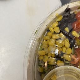 Hair in the food enclosed with the lid. Hair in the food enclosed with the lid.