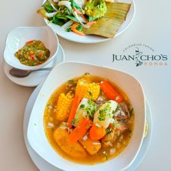Juanchos Fonda - Traditional Colombian sancocho: a hearty and flavorful stew with tender meats, fresh vegetables, and rich broth.