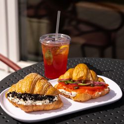 Lviv Croissants - A Select TWO combo with a Sweet Oreo Croissant and a Breakfast Lox & Cream Cheese Croissant, paired with a Pomegranate Lychee Lemonade.
