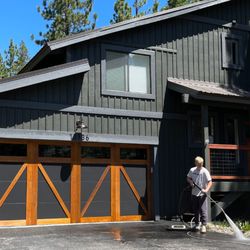 Northern Sky Builders - Muhlebach Way Remodel involved expanding the existing structure to accommodate a 2-car garage, updating the siding, fresh pain, and new roof