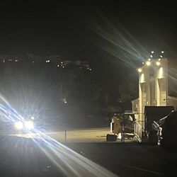 Graniterock - Employee shining his high beams at movie goers at the adjoining business, a drive in movie theatre at 11:30pm.