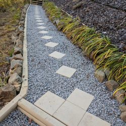 A Helping Hand Construction - Pathway leading to a beautiful garden