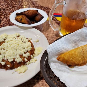 Colombia La Bella - a plate of food and a glass of beer - Colombian Near Me - Longwood, Florida
