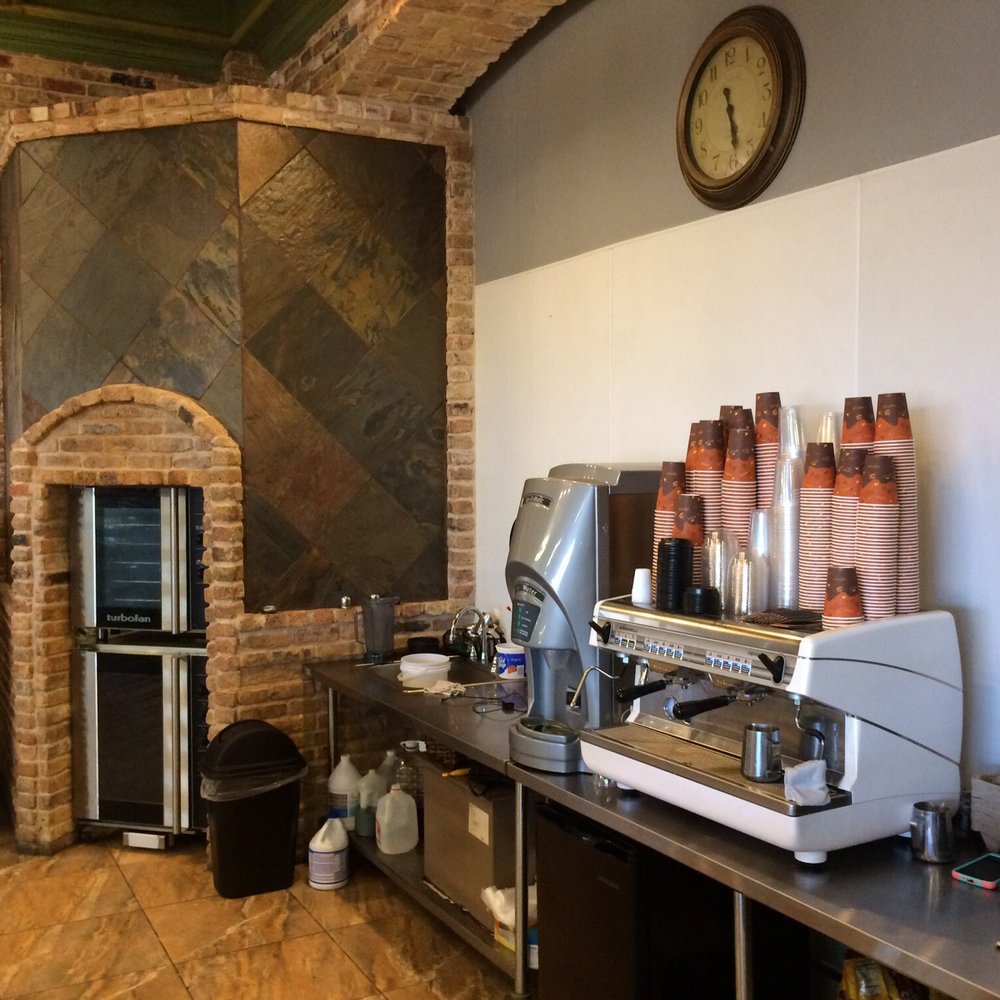 Paris Bakery - a coffee bar with a clock on the wall - Bakeries Near Me - Mission, Texas