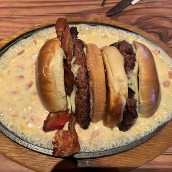 Miller's Ale House - Upside view of this amazing BACON CHEESEBURGER QUESO DUNK that's also a must try along with the other one. - Sports Bars Near Me - Palm Coast, Florida Miller's Ale House - Upside view of this amazing BACON CHEESEBURGER QUESO DUNK that's also a must try along with the other one. - Sports Bars Near Me - Palm Coast, Florida