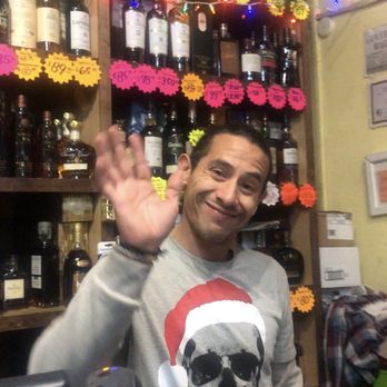Unity Fine Wine and Liquor - Photo of Simon smiling and displaying profound satisfaction in his abhorrent customer service. Pls see my review for more. - Beer, Wine & Spirits Near Me - New York, New York