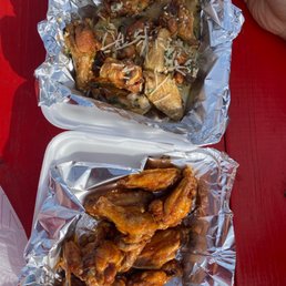 two trays of food on a red table