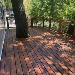 Alfaro Construction & Tree Service - Deck was custom cut to wrap around the tree, beautiful finish with the Cedar stain!