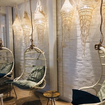 LOV - a row of hanging chairs in a room - Vegan Near Me - Brossard, Quebec
