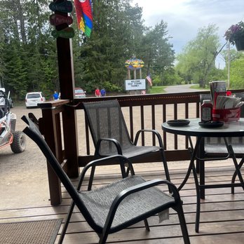 Slo's Pub - a patio with chairs and a table - Pubs Near Me - Woodruff, Wisconsin Slo's Pub - a patio with chairs and a table - Pubs Near Me - Woodruff, Wisconsin