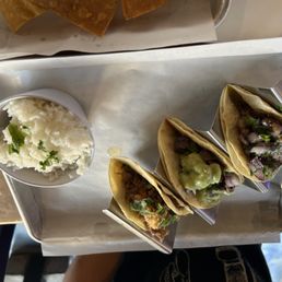 Variety tacos with side rice Variety tacos with side rice