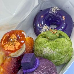 Malasadas and a mochi donut for good measure -- all super delicious! Malasadas and a mochi donut for good measure -- all super delicious!