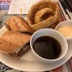 Huggin' Molly's - French dip with onion rings