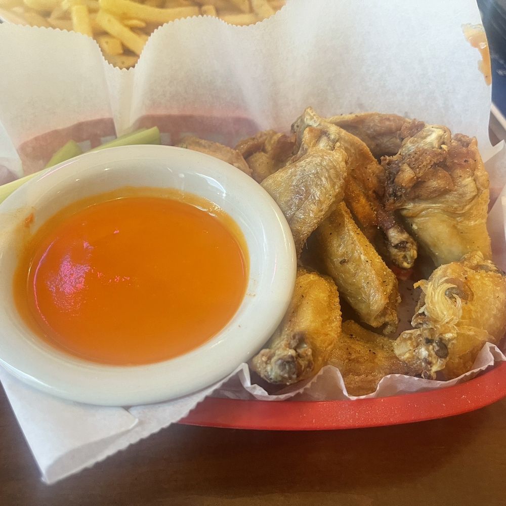 Toucans Bar & Grill - Lemon pepper wings with a side of buffalo sauce - Sports Bars Near Me - Clearwater, Florida Toucans Bar & Grill - Lemon pepper wings with a side of buffalo sauce - Sports Bars Near Me - Clearwater, Florida