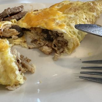 Addiction Bistro - Cut open- Grilled chicken, sautéed onion & pepper omelette with side of 2 sausage patties - Breakfast & Brunch Near Me - Coral Springs, Florida Addiction Bistro - Cut open- Grilled chicken, sautéed onion & pepper omelette with side of 2 sausage patties - Breakfast & Brunch Near Me - Coral Springs, Florida