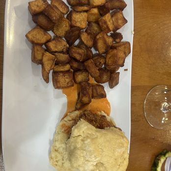 Ruby Slipper Orange Beach - Hot Honey Chicken Biscuit with extremely overcooked potatoes - Cafes Near Me - Orange Beach, Alabama Ruby Slipper Orange Beach - Hot Honey Chicken Biscuit with extremely overcooked potatoes - Cafes Near Me - Orange Beach, Alabama