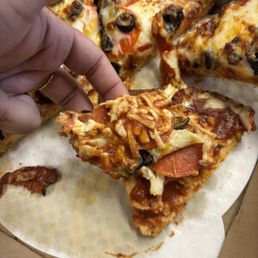Cold non-melted cheese yet burnt crust. Cold non-melted cheese yet burnt crust.