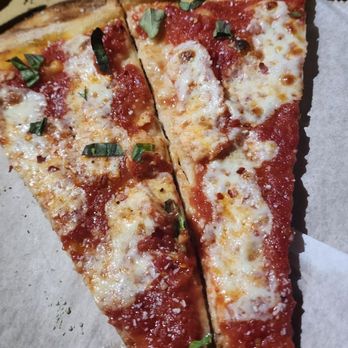 Angela’s Pizza - Margherita sliced in half to share. - Pizza Near Me - Jacksonville Beach, Florida Angela’s Pizza - Margherita sliced in half to share. - Pizza Near Me - Jacksonville Beach, Florida