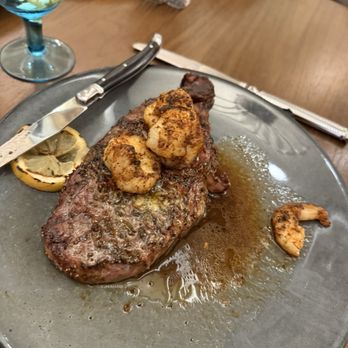 WATERMARK Baton Rouge, Autograph Collection - Rib eye with grilled shrimp - Hotels Near Me - Baton Rouge, Louisiana WATERMARK Baton Rouge, Autograph Collection - Rib eye with grilled shrimp - Hotels Near Me - Baton Rouge, Louisiana