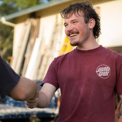 ATS Junk Removal - Friendly service and a job well done! Owner of ATS Junk Removal shaking hands with a satisfied customer.