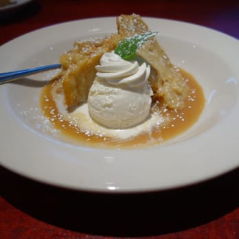 Lucky 32 Southern Kitchen - White Chocolate-Banana Bread Pudding served with vanilla ice cream and warm "Foster" sauce - New American Near Me - Cary, North Carolina Lucky 32 Southern Kitchen - White Chocolate-Banana Bread Pudding served with vanilla ice cream and warm "Foster" sauce - New American Near Me - Cary, North Carolina