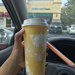 Mango green tea w/ strawberry popping boba Mango green tea w/ strawberry popping boba