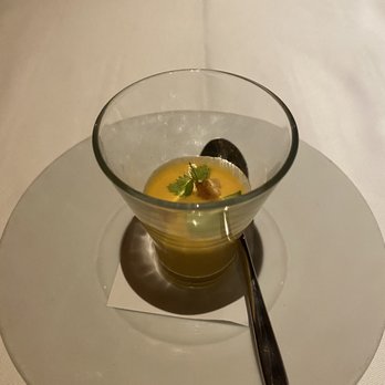 Michael Mina - Amuse bouche gaspacho. Light and refreshing. Little bit of dungeness crab on the bottom. - New American Near Me - Las Vegas, Nevada Michael Mina - Amuse bouche gaspacho. Light and refreshing. Little bit of dungeness crab on the bottom. - New American Near Me - Las Vegas, Nevada