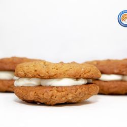 The Colorado Cookie Company - Soft and chewy oatmeal cream pies filled with our signature vanilla buttercream, baked fresh in Lakewood and perfect for gifting or enjoying