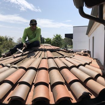 Reno's Roofing - Gabriel working on the round turret with 30 broken tiles - Roofing Near Me - Sylmar, California