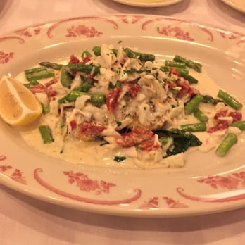 Maggiano's - Salmon Oscar was scrumptious! Salmon with jumbo lump crab, asparagus, sun-dried tomatoes, spinach in a garlic cream sauce. - Italian Near Me - Friendswood, Texas