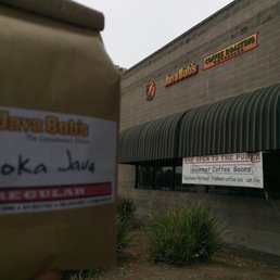 a coffee bag in front of a coffee shop a coffee bag in front of a coffee shop