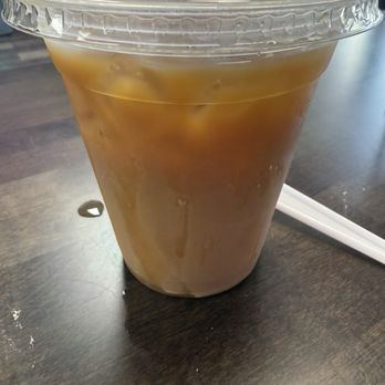 The Coffee Grove - Ice coffee with caramel; iced coffee flavored water - Coffee & Tea Near Me - Davenport, Florida The Coffee Grove - Ice coffee with caramel; iced coffee flavored water - Coffee & Tea Near Me - Davenport, Florida