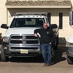 Another Towing Company - Shiloh, owner of Another Towing Company, poses with the fleet