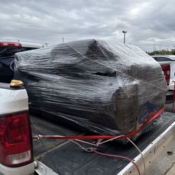 Furniture Outlet - Couch wrapped up and protected