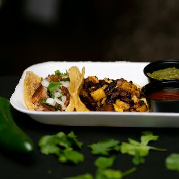 Trap Tacos - a tray of tacos and salsa - Tacos Near Me - Los Angeles, California Trap Tacos - a tray of tacos and salsa - Tacos Near Me - Los Angeles, California