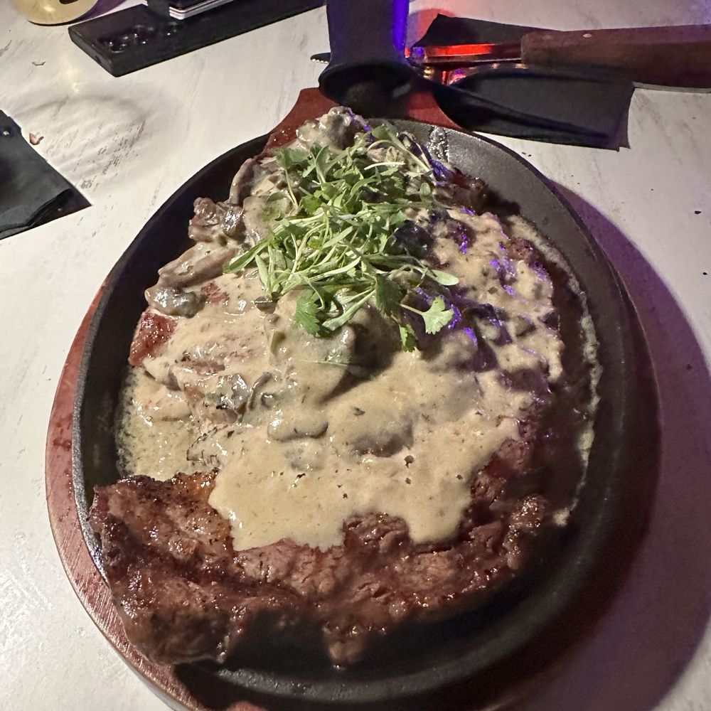 Pilon Miami - Ribeye Steak with Mushroom and Champagne Sauce - Latin American Near Me - Miami, Florida Pilon Miami - Ribeye Steak with Mushroom and Champagne Sauce - Latin American Near Me - Miami, Florida