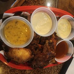 The smoked wings with half Mango Habanero and half Garlic Parmesan. Also got blue cheese and ranch on the side The smoked wings with half Mango Habanero and half Garlic Parmesan. Also got blue cheese and ranch on the side