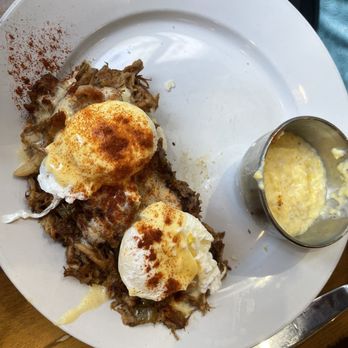 Fleur De Lis - Cochon De Lait Benedict with grits - Breakfast & Brunch Near Me - New Orleans, Louisiana