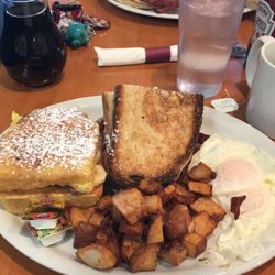 The Toast Office - "The Toast Office" with eggs over easy and banana Nutella stuffed French toast