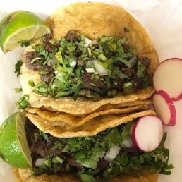 two tacos with a side of radishes two tacos with a side of radishes