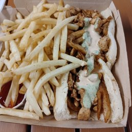 Chicken Saltado and fries. Chicken Saltado and fries.