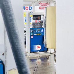 Massapequa Park-Mobil Service Center - This gas pump had different gas prices than the gas pump I was using, as well as the main gas pricing sign!