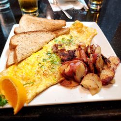 Keke's Breakfast Cafe - Philly steak omelet with red potatoes and wheat bread. Scrumptious!