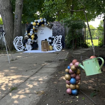 Monarch Balloons - Solid backdrop, butterflies, carpet and stool for Grad 2023 photo shoot. - Balloon Services Near Me