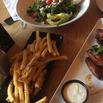 Cavo Bar and Kitchen - happy hour truffle fries, bbq wings, and entree sized smoked salmon salad - Bars Near Me - Vancouver, British Columbia Cavo Bar and Kitchen - happy hour truffle fries, bbq wings, and entree sized smoked salmon salad - Bars Near Me - Vancouver, British Columbia