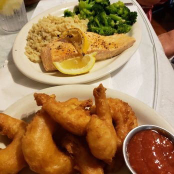 River House - Fried shrimp appetizer and salmon dinner - American Near Me - Alexandria Bay, New York River House - Fried shrimp appetizer and salmon dinner - American Near Me - Alexandria Bay, New York