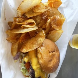 Cheeseburger with chips. Cheeseburger with chips.