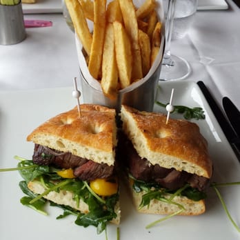 Diamond Club - 7oz sirloin steak sandwich with wild arugula, roasted tomatoes, grilled onions, and french fries - Stadiums & Arenas Near Me - Anaheim, California