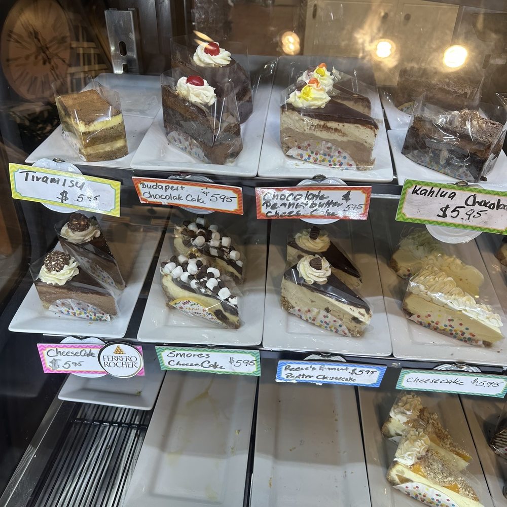 Cafe Budapest - a display case with a variety of desserts - Bakeries Near Me - Fitzgerald, Georgia